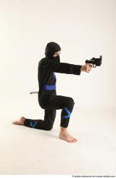 VLASTIMIL KNEELING POSE WITH GUN